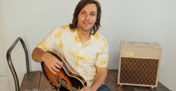 Charlie Worsham holding electric guitar