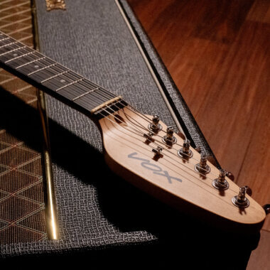 Vox Mark V Mini Guitar white headstock close up.
