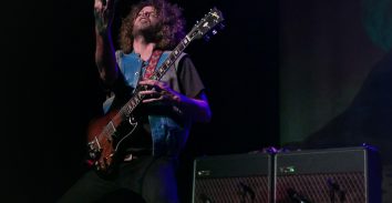 artist, Andrew James Stockdale, playing electric guitar beside VOX amplifiers