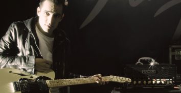 artist, Brendon Urie, holding electric guitar