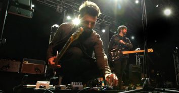 artist, Dom Craik, adjusting levels in concert