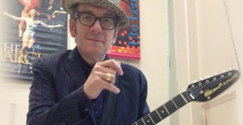 artist, Elvis Costello, holding electric guitar