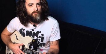 artist, Jake Snider, holding electric guitar