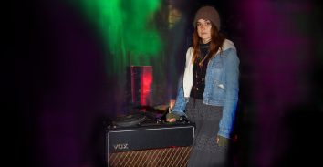 artist,, Theresa Wayman, standing next to VOX amplifier